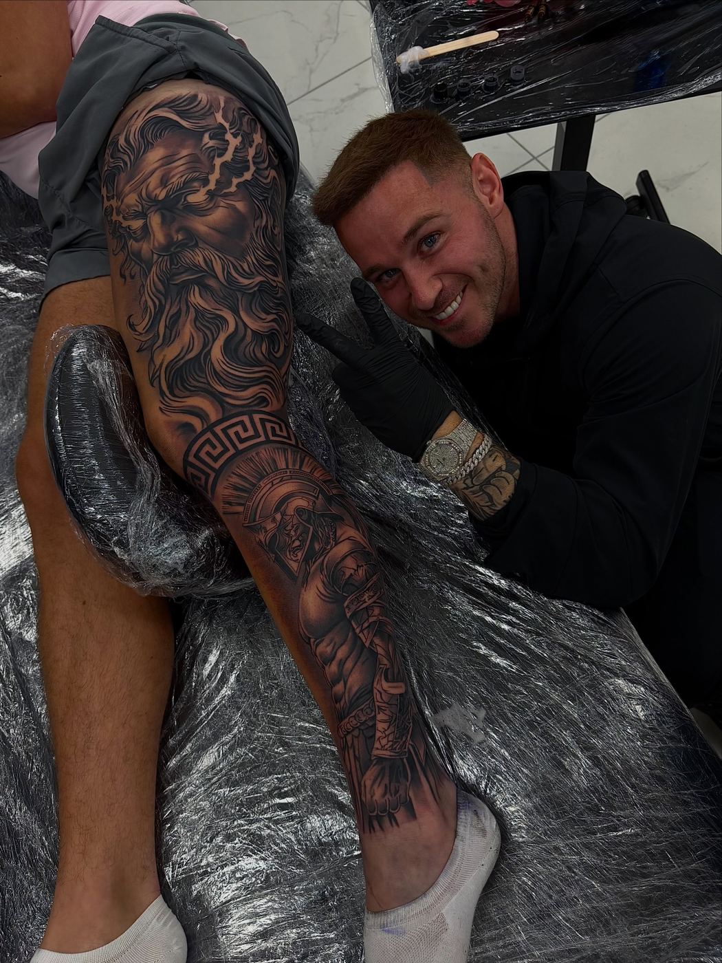 Paul with a client after a leg sleeve session